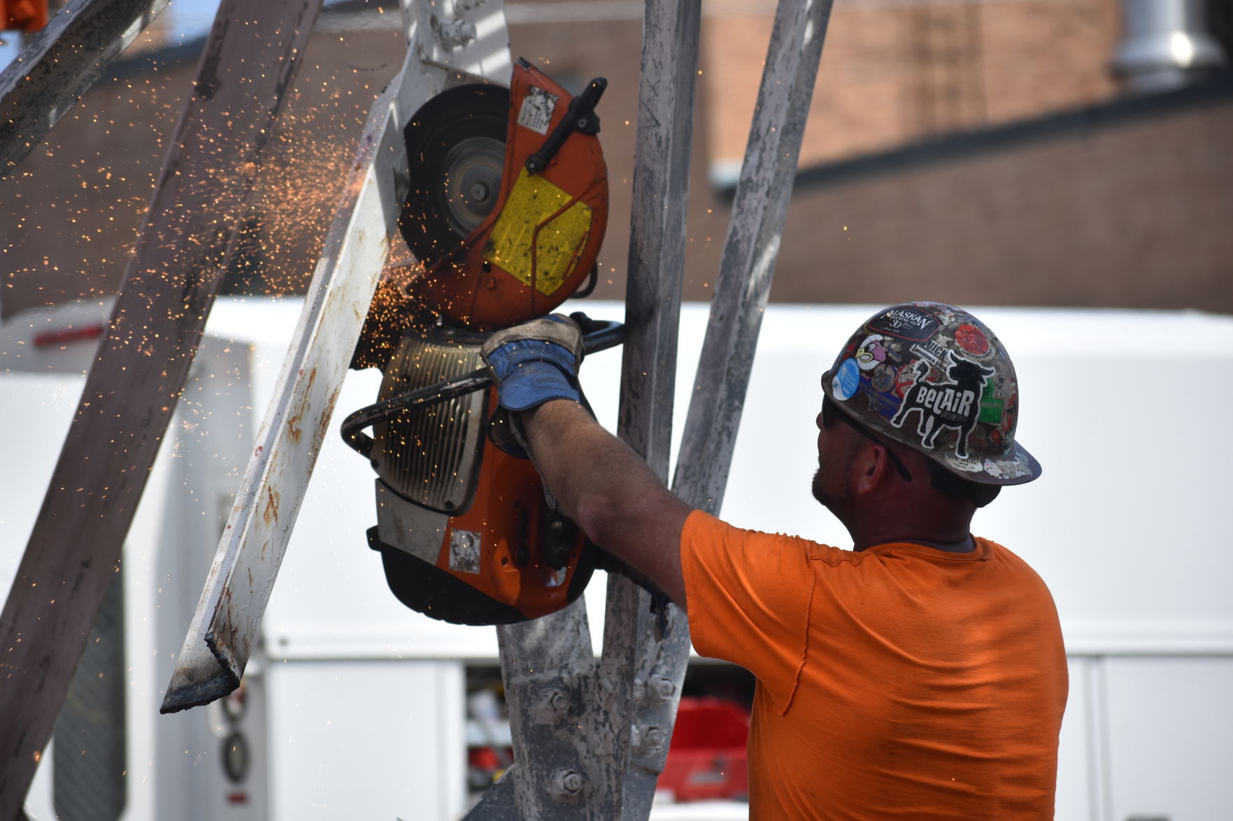 A towering job: Crews dismantle phone tower